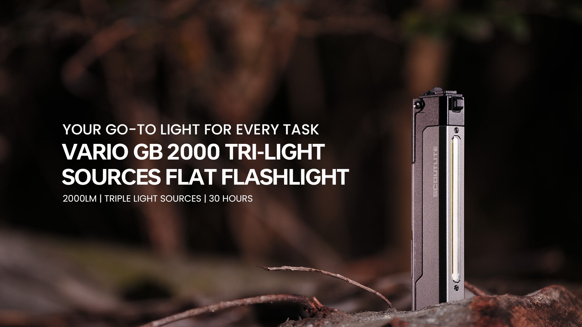 Vario 2000 tri-light sources flat flashlight standing on a log at night